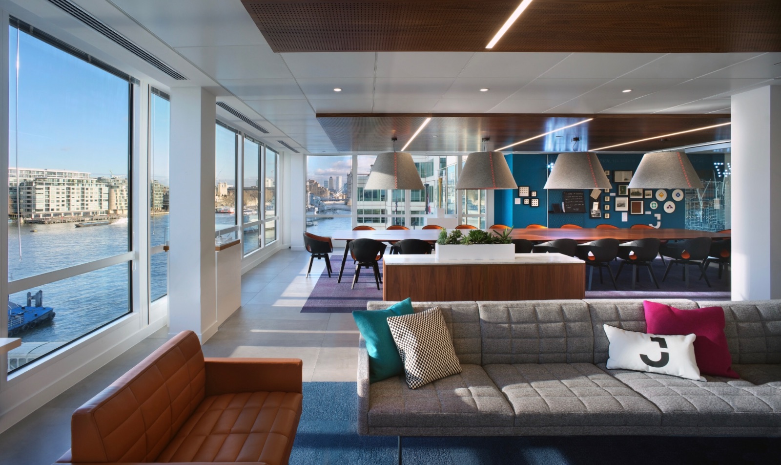 A finance workplace, river-facing lounge and meeting hub, built from the destinations model
